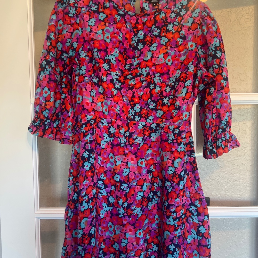 Wednesday’s girl, floral dress with a mini back cut-out